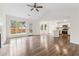 Open-concept living room with hardwood floors seamlessly connects to the kitchen at 5615 Crystal Hl, Stone Mountain, GA 30088