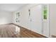 Bright and airy living room featuring hardwood floors and a large window at 5615 Crystal Hl, Stone Mountain, GA 30088