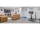 Finished basement with a seating area and gym at 5055 Stefan Ridge Way, Buford, GA 30519