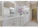 Bright bathroom featuring double vanity, quartz countertops, and ample storage space at 5055 Stefan Ridge Way, Buford, GA 30519