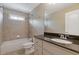 Bathroom with granite countertops, a tub and shower combination, and neutral tile at 5055 Stefan Ridge Way, Buford, GA 30519