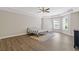 Primary bedroom with trey ceilings, hardwood laminate flooring, and large windows at 5055 Stefan Ridge Way, Buford, GA 30519