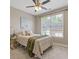 Bright bedroom with large window, neutral decor, and ceiling fan at 5055 Stefan Ridge Way, Buford, GA 30519