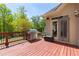 Deck with stainless steel BBQ grill and door to interior of home at 5055 Stefan Ridge Way, Buford, GA 30519