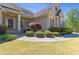 Charming home with stone accents, manicured landscaping, and a welcoming front porch at 5055 Stefan Ridge Way, Buford, GA 30519