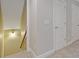Hallway with a view of the staircase and white doors at 5055 Stefan Ridge Way, Buford, GA 30519