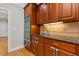 Kitchen with stainless steel double ovens, granite countertops, hardwood floors and custom cabinetry at 5055 Stefan Ridge Way, Buford, GA 30519