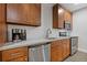 Modern kitchen with granite countertops, stainless steel appliances, and wood cabinetry at 5055 Stefan Ridge Way, Buford, GA 30519