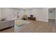 Spacious living area with french doors to the backyard and hardwood laminate flooring at 5055 Stefan Ridge Way, Buford, GA 30519