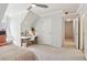 Bright bedroom with desk, chair, ceiling fan, and carpet flooring at 2305 Stonevalley Ct, Cumming, GA 30041