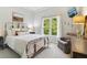 Comfortable bedroom with natural light from large windows, providing a serene and inviting space at 2305 Stonevalley Ct, Cumming, GA 30041