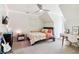 Bright bedroom with desk, chair, ceiling fan, and carpet flooring at 2305 Stonevalley Ct, Cumming, GA 30041
