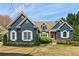 Charming two-story home boasts a well-manicured front yard, stone accents and a welcoming front porch at 2305 Stonevalley Ct, Cumming, GA 30041
