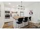 Charming kitchen with stainless appliances, island, and modern lighting at 2305 Stonevalley Ct, Cumming, GA 30041