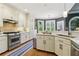 Modern kitchen featuring stainless steel appliances, white cabinetry, and granite countertops at 2305 Stonevalley Ct, Cumming, GA 30041