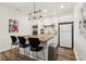Contemporary kitchenette featuring a wooden island, modern appliances, and sleek finishes at 2305 Stonevalley Ct, Cumming, GA 30041
