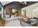 Spacious living room with vaulted ceiling, fireplace, built-in shelving, and comfortable seating at 2305 Stonevalley Ct, Cumming, GA 30041