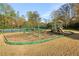 Community playground features a slide, climbing area, and swings near tennis courts for active lifestyles at 2305 Stonevalley Ct, Cumming, GA 30041