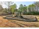 Community playground features a slide, climbing area, and swings, perfect for outdoor fun at 2305 Stonevalley Ct, Cumming, GA 30041