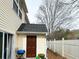 Backyard featuring a wooden fence, siding, and door to outside at 801 Old Peachtree Nw Rd # 15, Lawrenceville, GA 30043