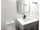 Bathroom featuring vanity with white countertop, gray cabinet, matte black hardware, and toilet at 801 Old Peachtree Nw Rd # 15, Lawrenceville, GA 30043
