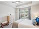 Bedroom featuring a tray ceiling, large window, and seating bench at 2048 Violet Lane, Brookhaven, GA 30319
