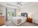 Comfortable bedroom with a queen-size bed, soft lighting, and a tray ceiling at 2048 Violet Lane, Brookhaven, GA 30319