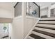 Inviting foyer features a staircase with iron spindles and a clear view of the front door with decorative wreath at 2048 Violet Lane, Brookhaven, GA 30319