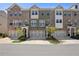 Charming townhome exterior featuring a brick facade, multi-car garage, and inviting entrance at 2048 Violet Lane, Brookhaven, GA 30319