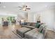 Open-concept living room with large sofa, view of the kitchen and dining area, creating a perfect space to entertain at 2048 Violet Lane, Brookhaven, GA 30319