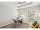 Well-lit home office area featuring a modern desk, comfortable seating, and natural light at 2048 Violet Lane, Brookhaven, GA 30319