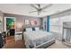 Bedroom with gray walls, a tufted headboard, adjacent to an en-suite bathroom for privacy and convenience at 2051 Wildflower Way, Conyers, GA 30012