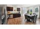 Features a granite countertop and a dining area with chairs in an naturally lit space at 2051 Wildflower Way, Conyers, GA 30012