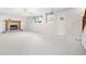 Finished basement with a stone fireplace, carpet, and a built-in bookshelf at 434 Meadowfield Ct, Lawrenceville, GA 30043