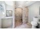 Contemporary bathroom featuring a glass-enclosed shower, modern toilet, and vanity at 434 Meadowfield Ct, Lawrenceville, GA 30043