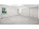 Bright bedroom features large closets and carpet flooring, with ample space and natural light at 434 Meadowfield Ct, Lawrenceville, GA 30043