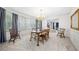 Dining room with wood table, chandelier, and a view into the living room at 434 Meadowfield Ct, Lawrenceville, GA 30043