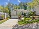 Charming home with a two-car garage, landscaped front yard, and inviting front entrance at 434 Meadowfield Ct, Lawrenceville, GA 30043