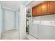 This is a great laundry room with washer and dryer, utility sink and storage cabinets at 434 Meadowfield Ct, Lawrenceville, GA 30043