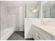 Modern bathroom featuring bathtub and grey tile flooring at 831 Mercury Nw Dr, Atlanta, GA 30331