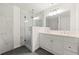 Modern bathroom boasts a double vanity and a glass-enclosed shower at 831 Mercury Nw Dr, Atlanta, GA 30331