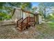 Charming home exterior with a wooden staircase and natural surroundings at 831 Mercury Nw Dr, Atlanta, GA 30331