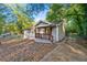 Charming single-story home with a cozy front porch and traditional wood shutters at 831 Mercury Nw Dr, Atlanta, GA 30331