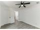 Clean bedroom with hardwood floors, ceiling fan, closet, and natural light, creating a peaceful retreat at 1318 Graymont Sw Dr, Atlanta, GA 30310