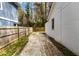 Side view of a backyard fence and a concrete driveway on the side of a house at 1318 Graymont Sw Dr, Atlanta, GA 30310