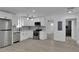Bright kitchen featuring white cabinets, stainless steel appliances, modern countertops, and hardwood floors at 1318 Graymont Sw Dr, Atlanta, GA 30310