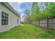 A lovely fenced-in backyard with green grass offers privacy and room to roam at 2899 Duncan Pl, Decatur, GA 30034