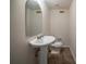 This bathroom has a pedestal sink, toilet and mirror at 2899 Duncan Pl, Decatur, GA 30034