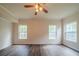 Bright bedroom with hardwood floors, a ceiling fan, and natural light at 2899 Duncan Pl, Decatur, GA 30034