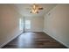 Spacious bedroom with hardwood floors, a ceiling fan, and natural light at 2899 Duncan Pl, Decatur, GA 30034